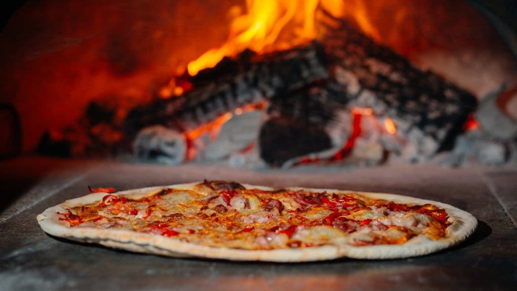 Pizza baked in wood burning oven