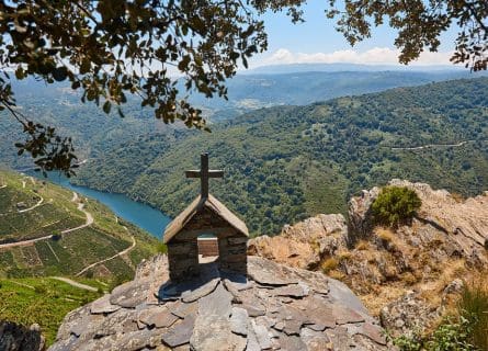 Old stone chapel overlooking river in Sil Canyon